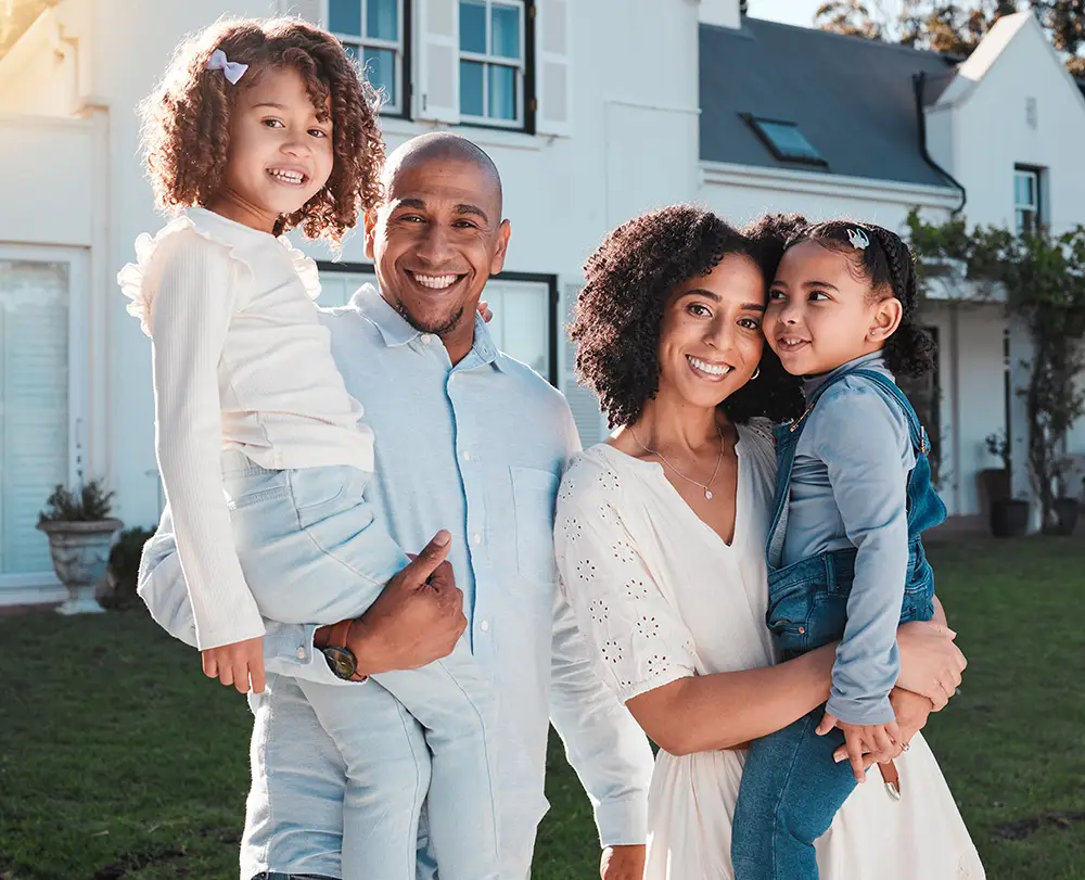 Family outside their Detroit home protected by comprehensive property and life insurance