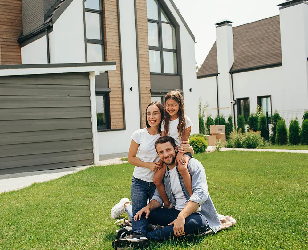 Family outside their Redford Twp. home protected by comprehensive property and life insurance.